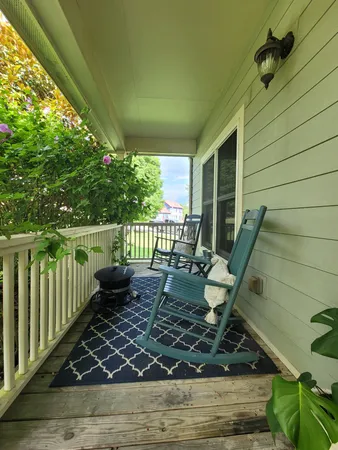 a view of a porch with furniture
