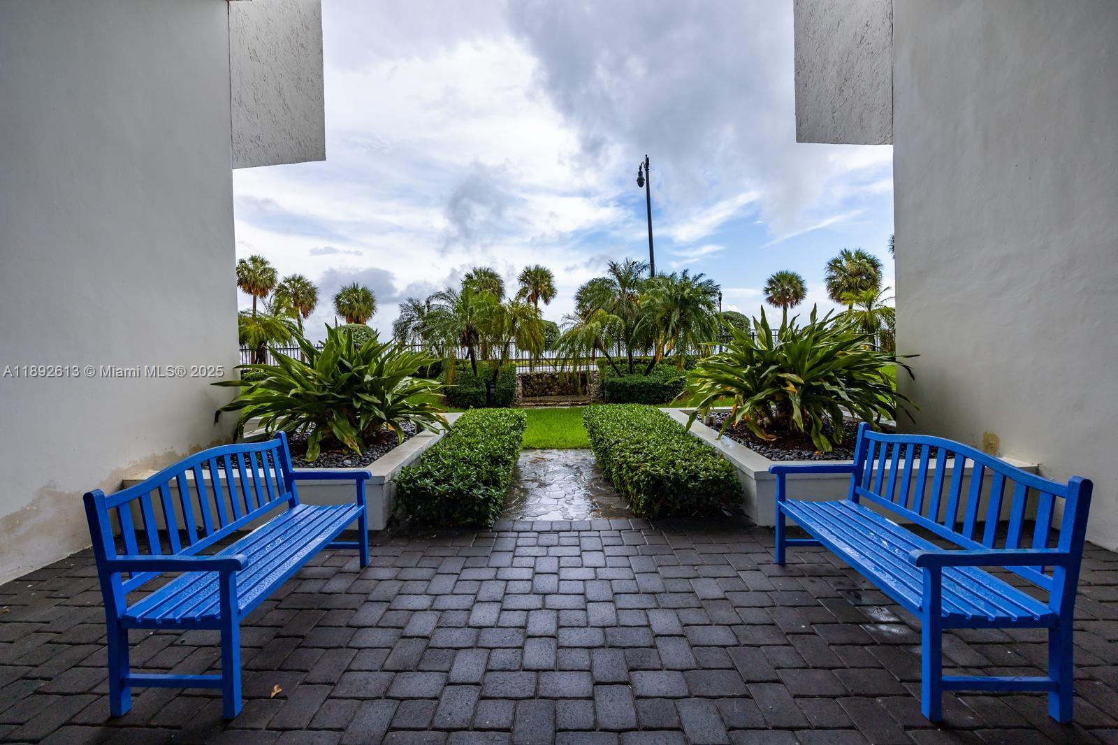 1440 Brickell Bay Drive, Unit 307 Miami, FL 33131 - Photo 22 of 28 a view of a chairs in wooden deck