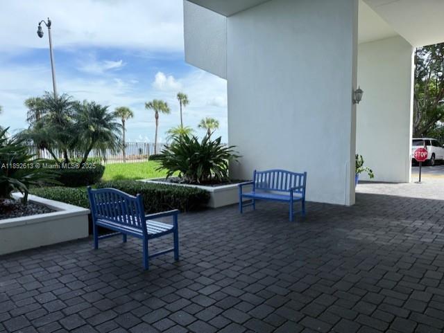 1440 Brickell Bay Drive, Unit 307 Miami, FL 33131 - Photo 27 of 28 a living room with furniture and a potted plants