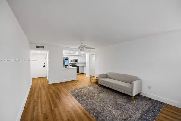 a kitchen with a refrigerator sink and microwave