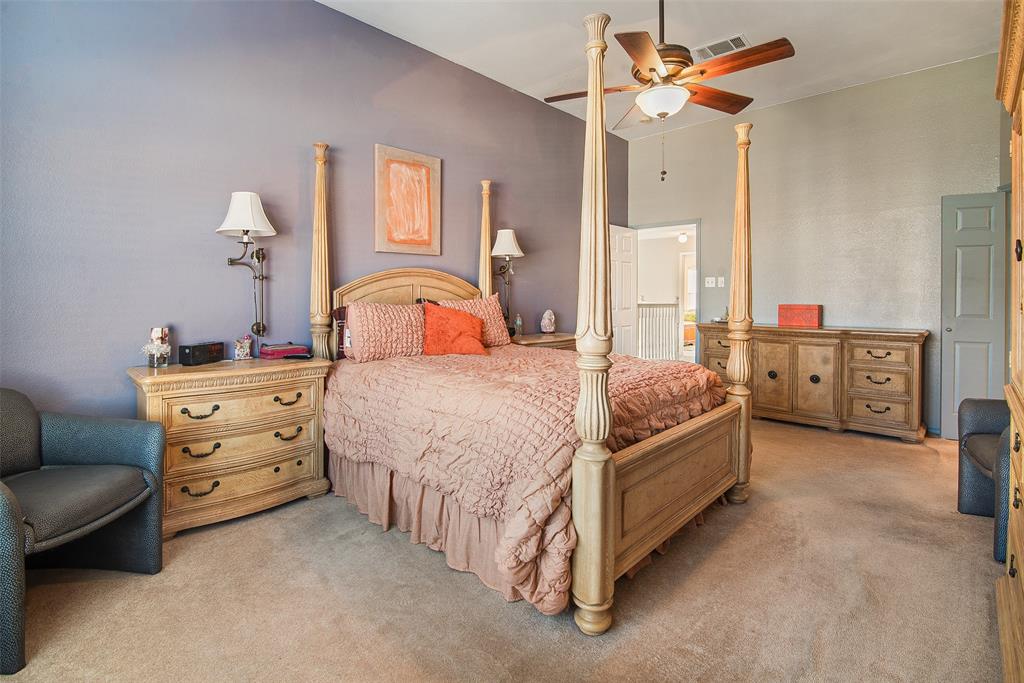 409 Red River Trail Irving, TX 75063 - Photo 15 of 31 a bedroom with a bed and a dresser