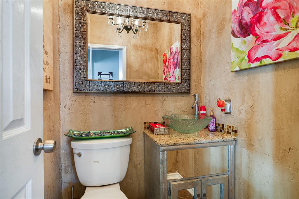409 Red River Trail Irving, TX 75063 - Photo 26 of 31 a bathroom with a granite countertop sink a mirror and a shower curtain