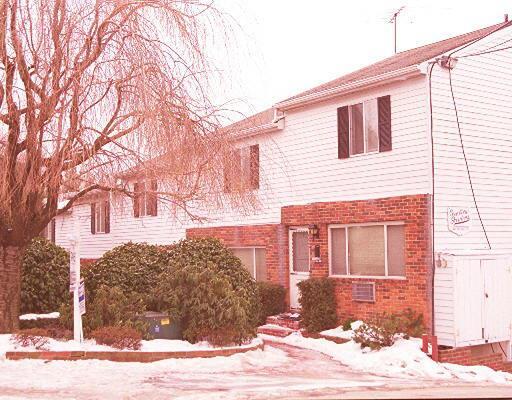 463 Cove Road, Unit 3 Stamford, CT 06902 - Photo 1 of 1 a front view of a house with a yard