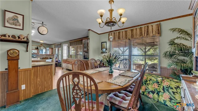 a bathroom with a granite countertop sink mirror and a window