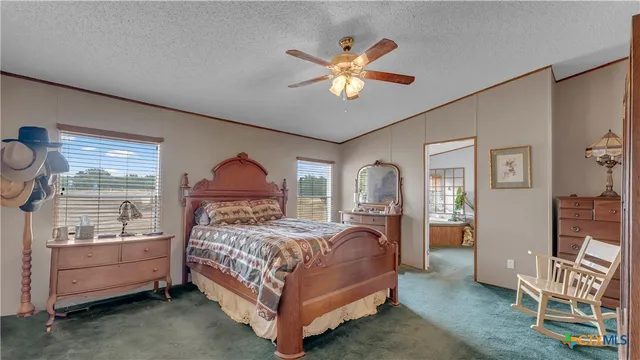 a room with table chair and window