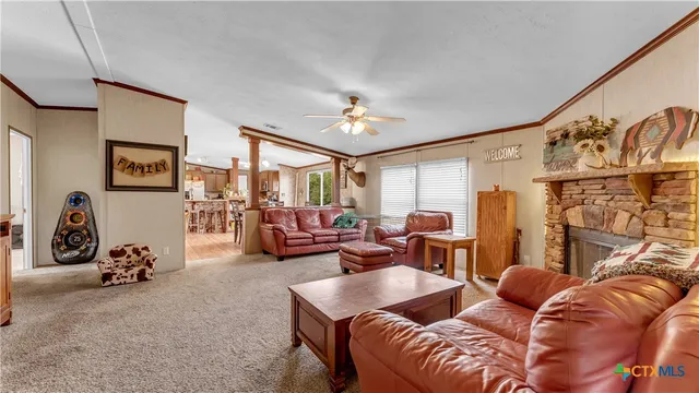 a kitchen with stainless steel appliances granite countertop a refrigerator a stove top oven a sink and dishwasher