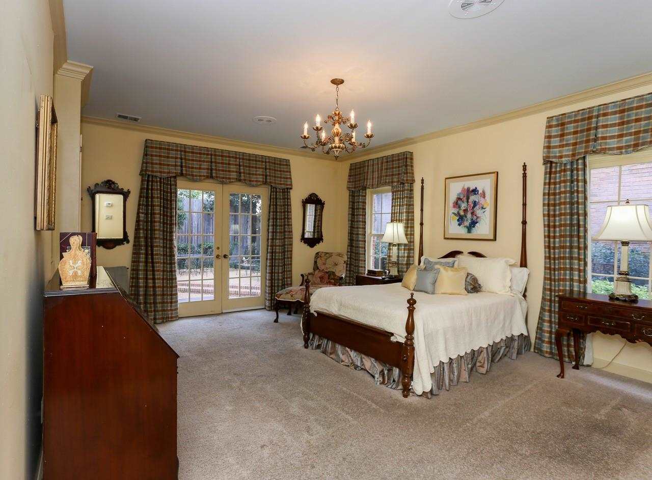 319 Inkberry Lane Memphis, TN 38117 - Photo 13 of 24 Primary bedroom is located downstairs and has doors that exit onto patio.
