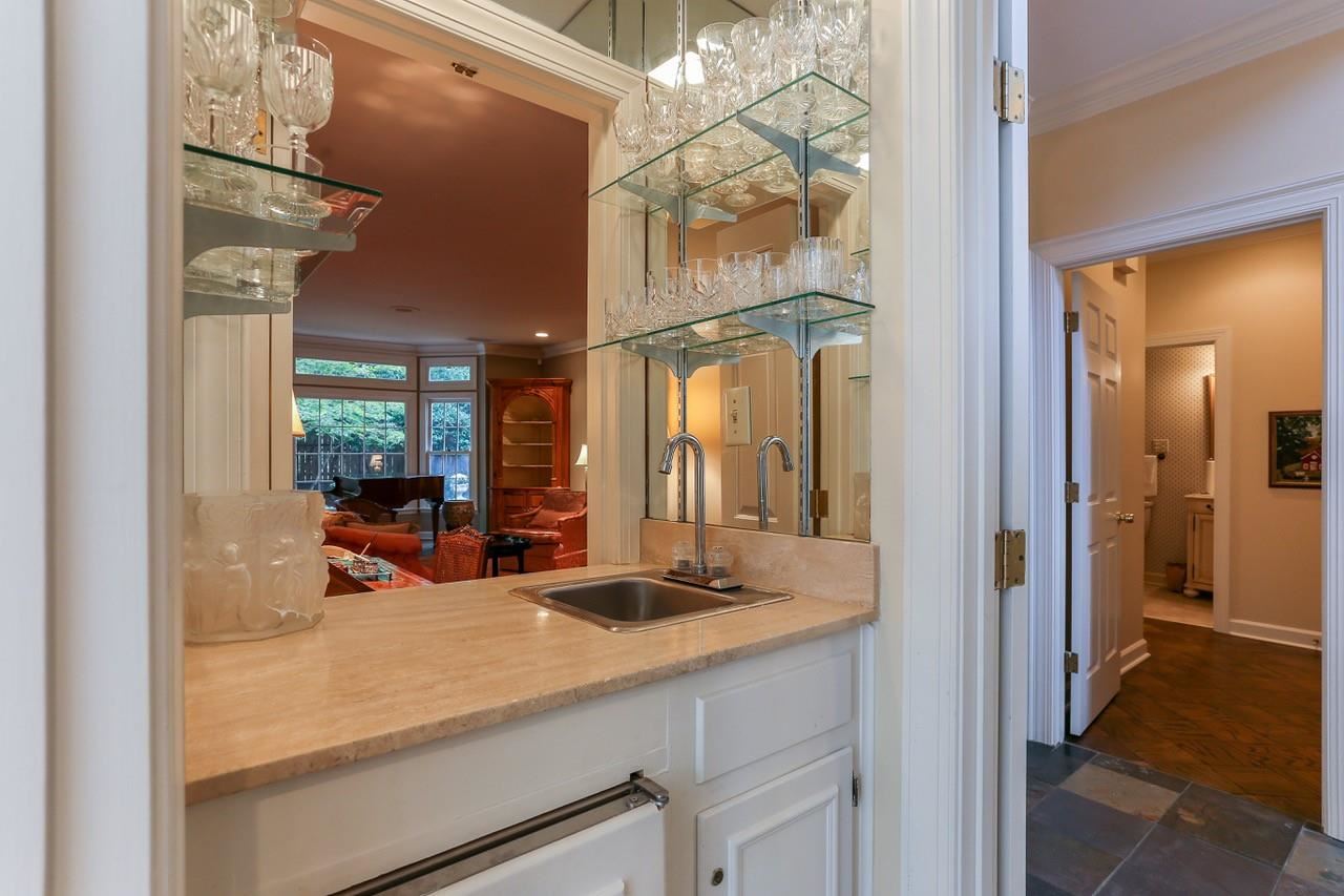 319 Inkberry Lane Memphis, TN 38117 - Photo 9 of 24 The wet bar is right past the entry and looks into the living room. Perfect for entertaining!
