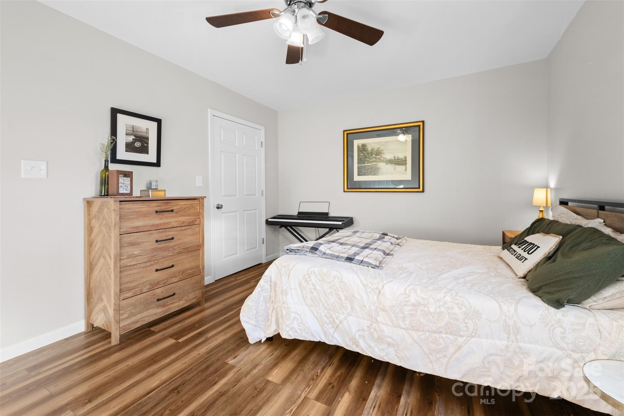 177 Duke Street Granite Falls, NC 28630 - Photo 13 of 23 a bedroom with a bed and a dresser