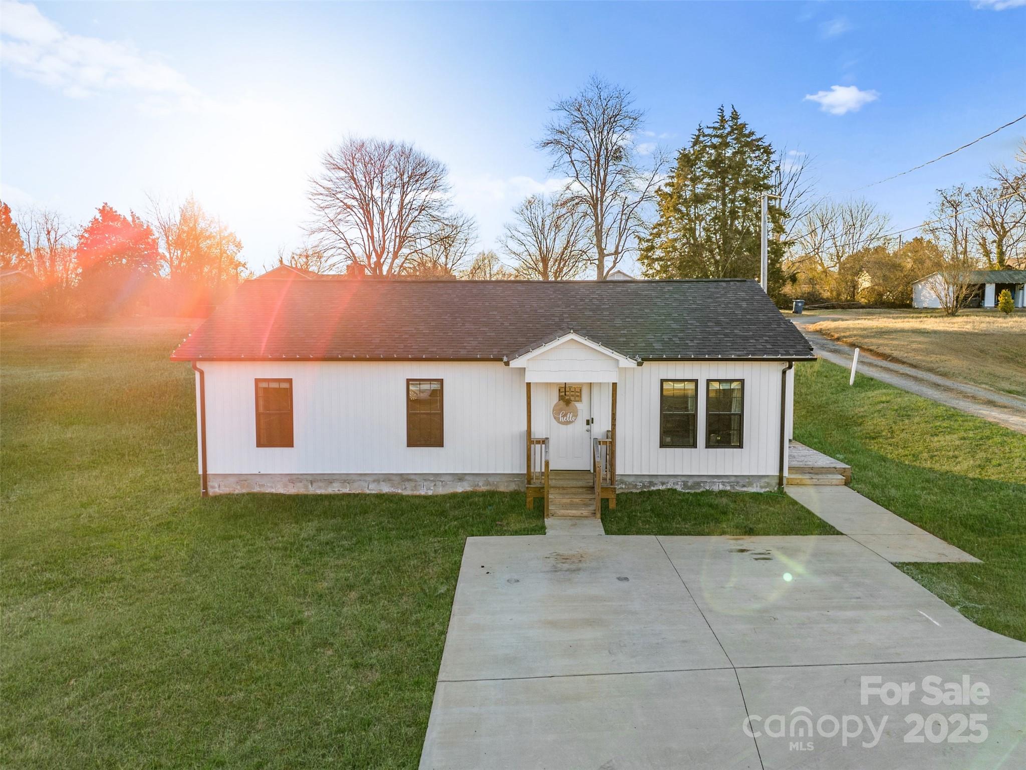 177 Duke Street Granite Falls, NC 28630 - Photo 4 of 23 a front view of a house with garden