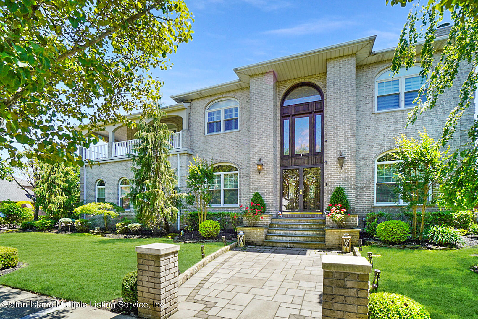 312 Shore Road Staten Island, NY 10307 - Photo 1 of 73 a front view of a house with garden