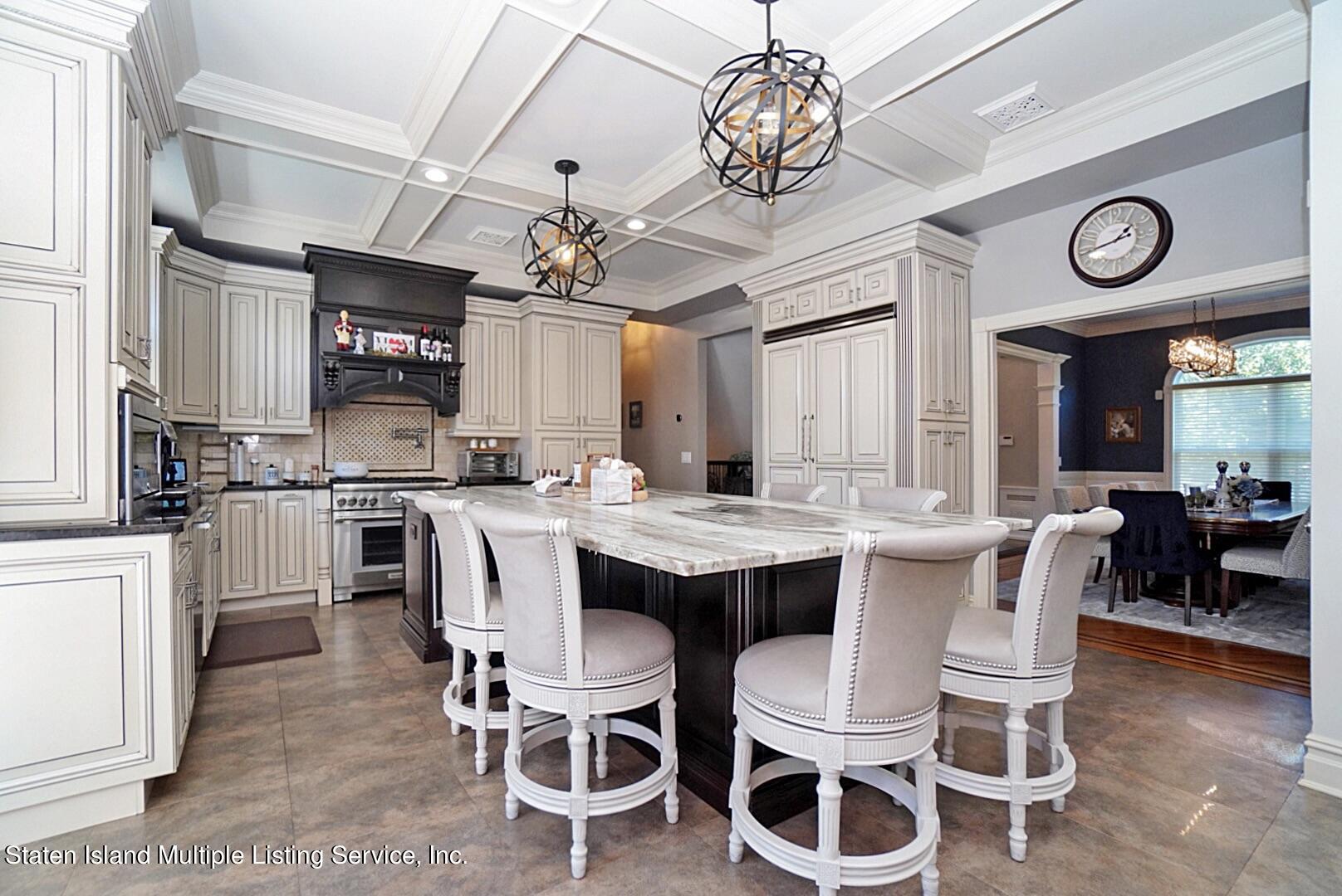 312 Shore Road Staten Island, NY 10307 - Photo 25 of 73 a large kitchen with a table and chairs