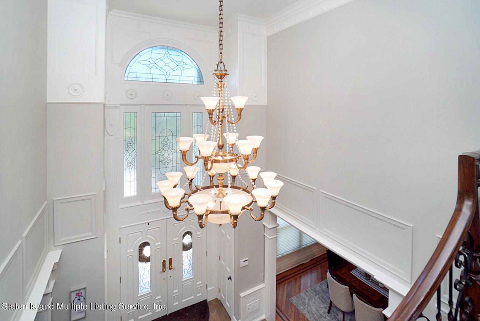 312 Shore Road Staten Island, NY 10307 - Photo 32 of 73 a dining room with chandelier fan and wooden floor