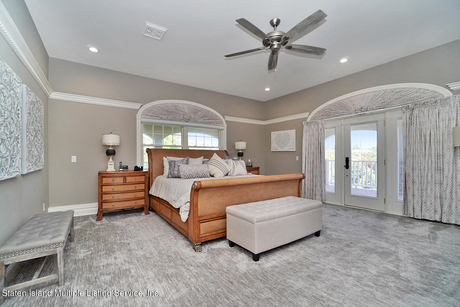 312 Shore Road Staten Island, NY 10307 - Photo 34 of 73 a bed room with a bed and a chandelier