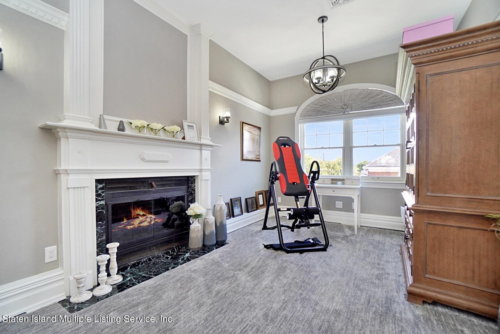 312 Shore Road Staten Island, NY 10307 - Photo 37 of 73 a view of a livingroom with furniture and a fireplace