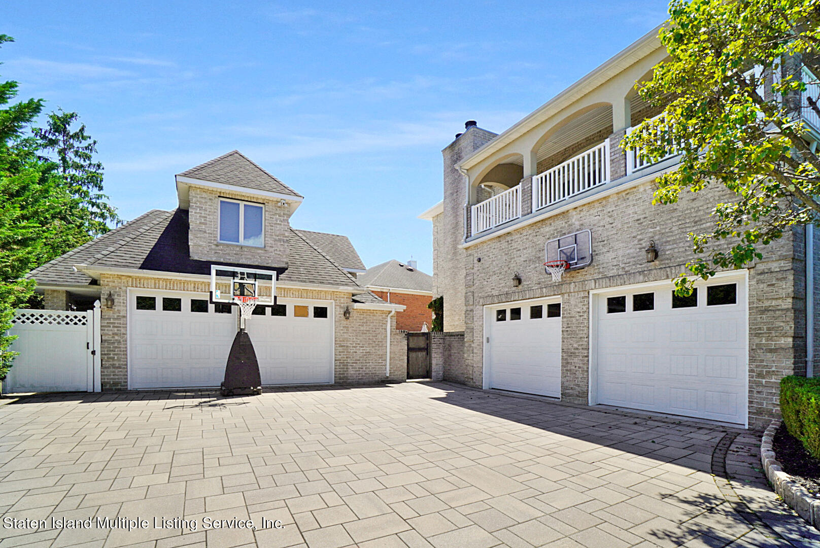 312 Shore Road Staten Island, NY 10307 - Photo 4 of 73 a front view of a house with a yard