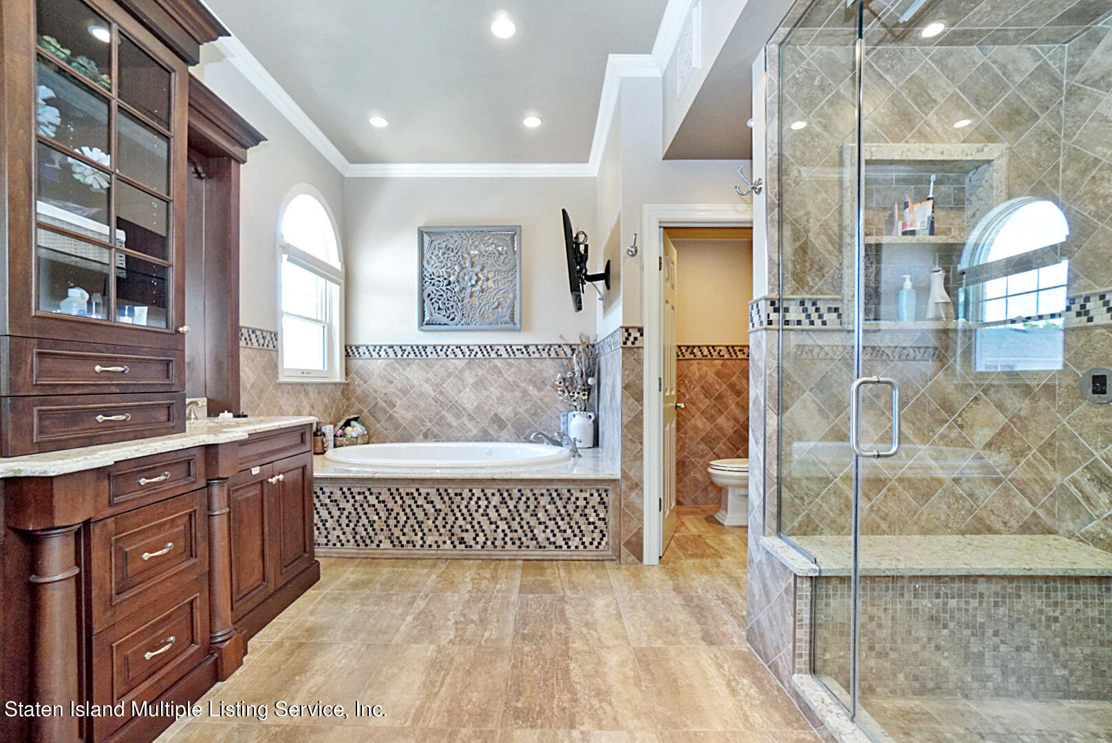 312 Shore Road Staten Island, NY 10307 - Photo 43 of 73 a bathroom with a tub a sink and a shower