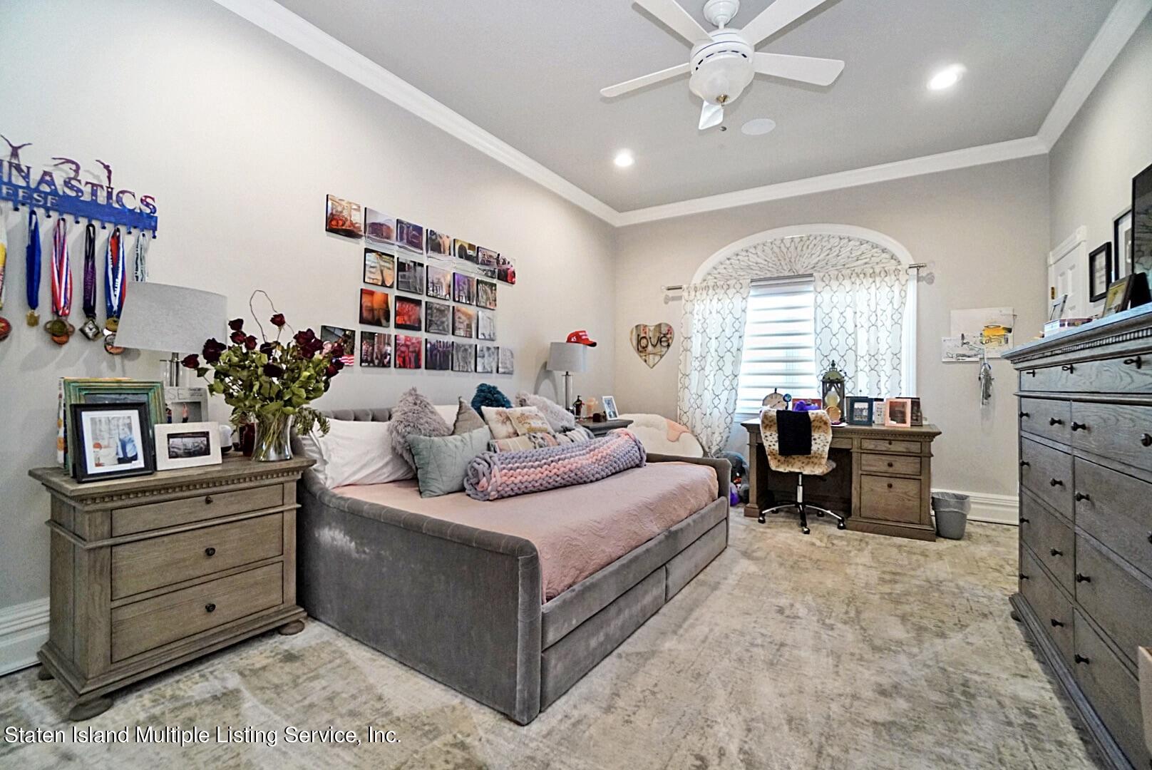312 Shore Road Staten Island, NY 10307 - Photo 48 of 73 a bedroom with a bed and furniture