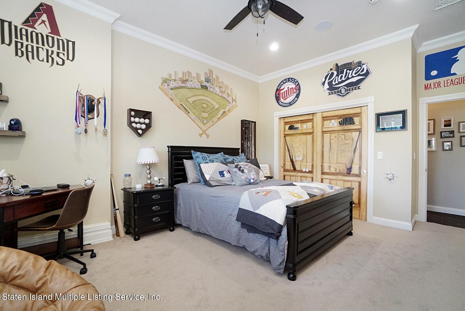 312 Shore Road Staten Island, NY 10307 - Photo 53 of 73 a spacious bedroom with a bed and a desk