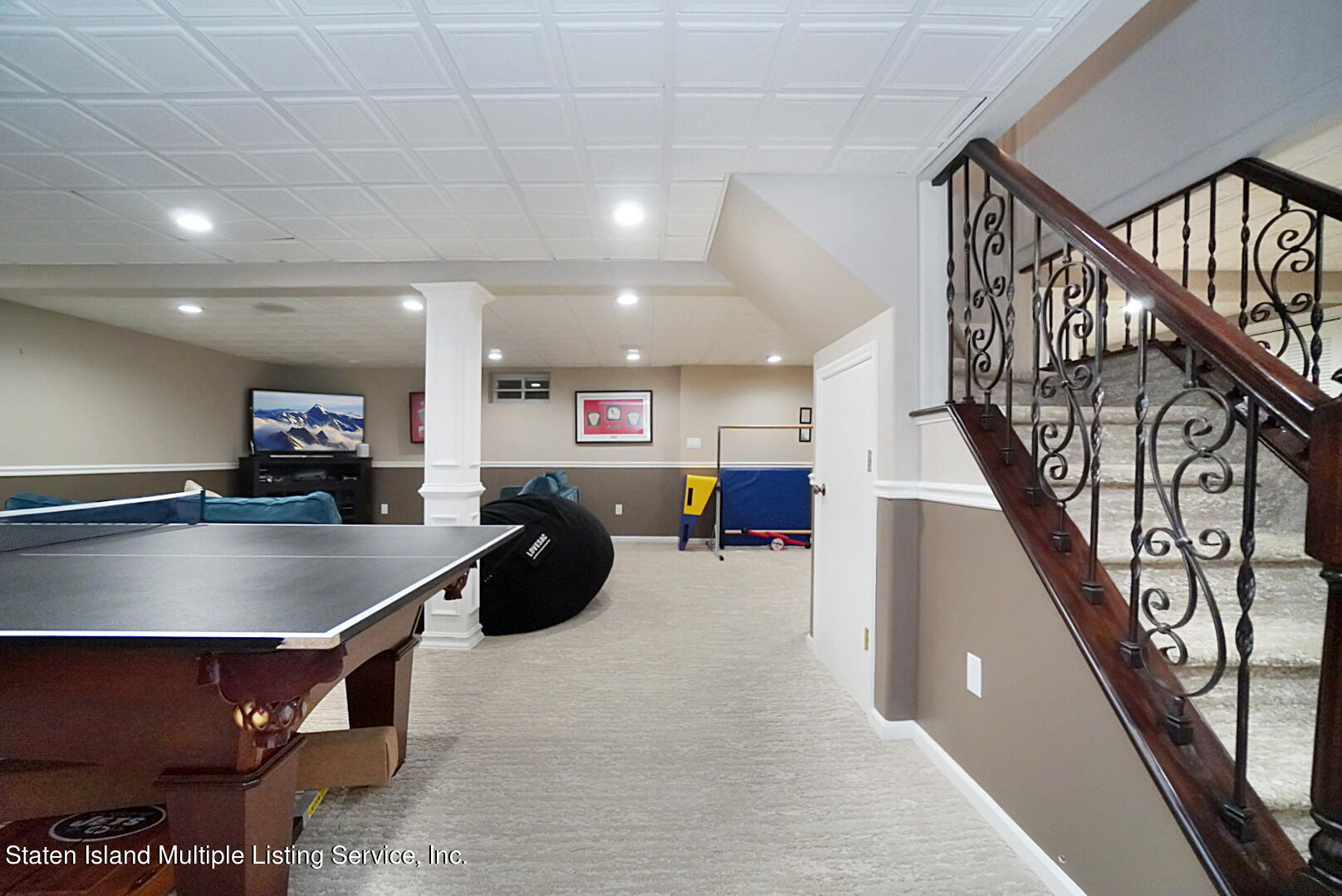 312 Shore Road Staten Island, NY 10307 - Photo 56 of 73 a room with lots of furniture and stairs