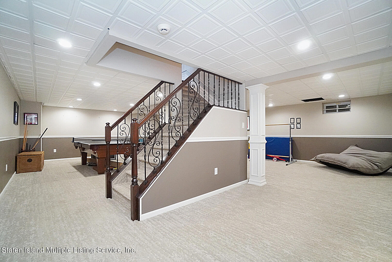 312 Shore Road Staten Island, NY 10307 - Photo 58 of 73 a living room with furniture and a chandelier