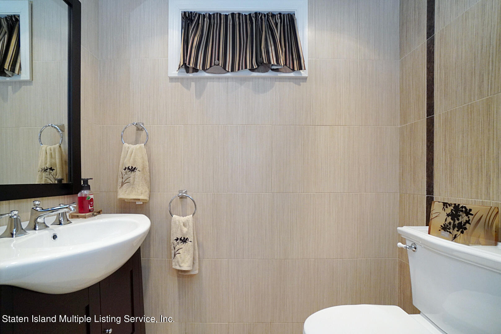 312 Shore Road Staten Island, NY 10307 - Photo 59 of 73 a bathroom with a sink and a toilet