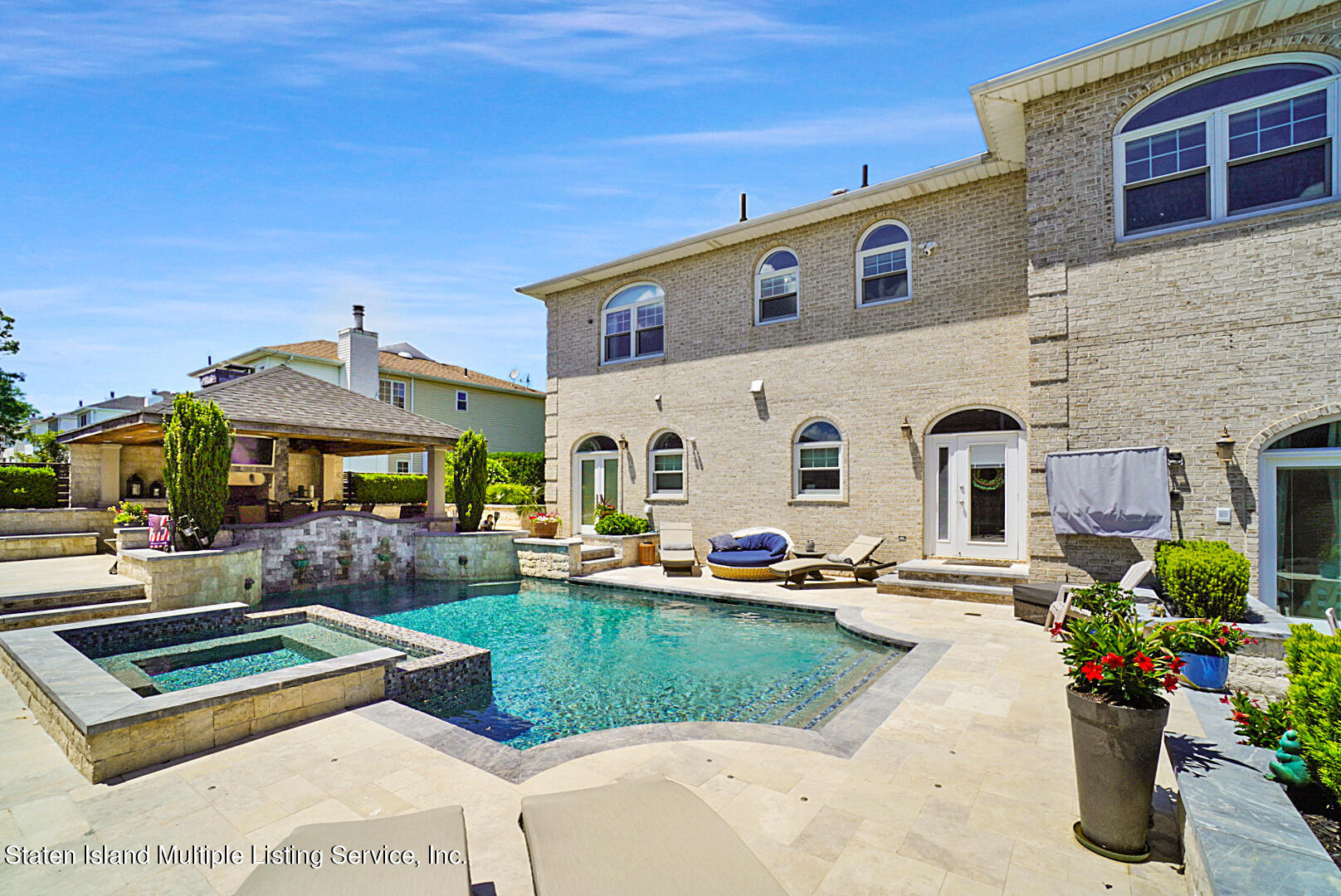 312 Shore Road Staten Island, NY 10307 - Photo 62 of 73 a front view of a house with garden and patio