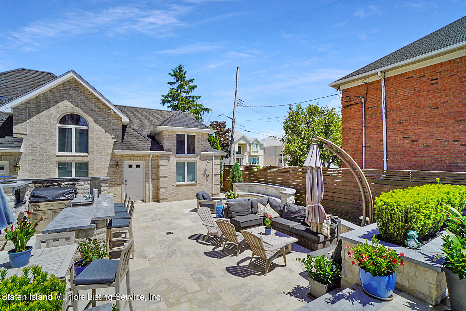 312 Shore Road Staten Island, NY 10307 - Photo 64 of 73 a view of a house with backyard sitting area and garden