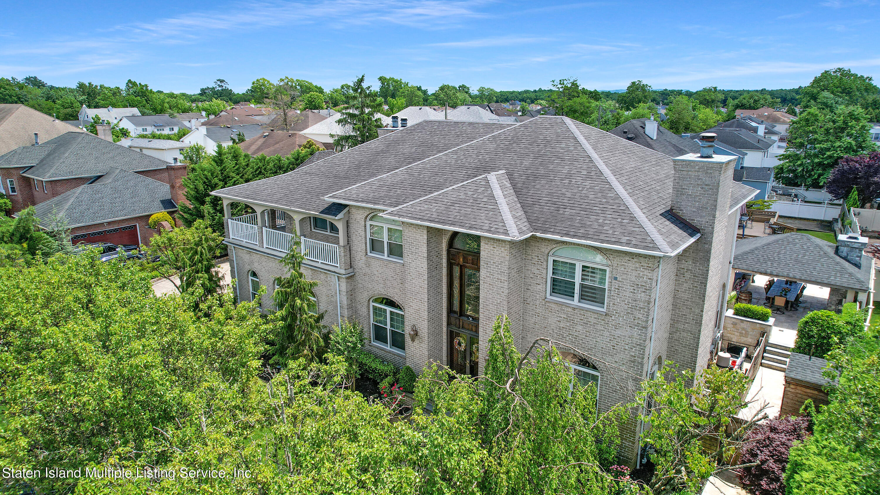 312 Shore Road Staten Island, NY 10307 - Photo 7 of 73 an aerial view of a house with yard and outdoor seating