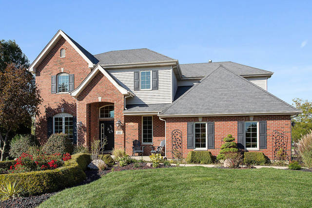 front view of a house with a yard