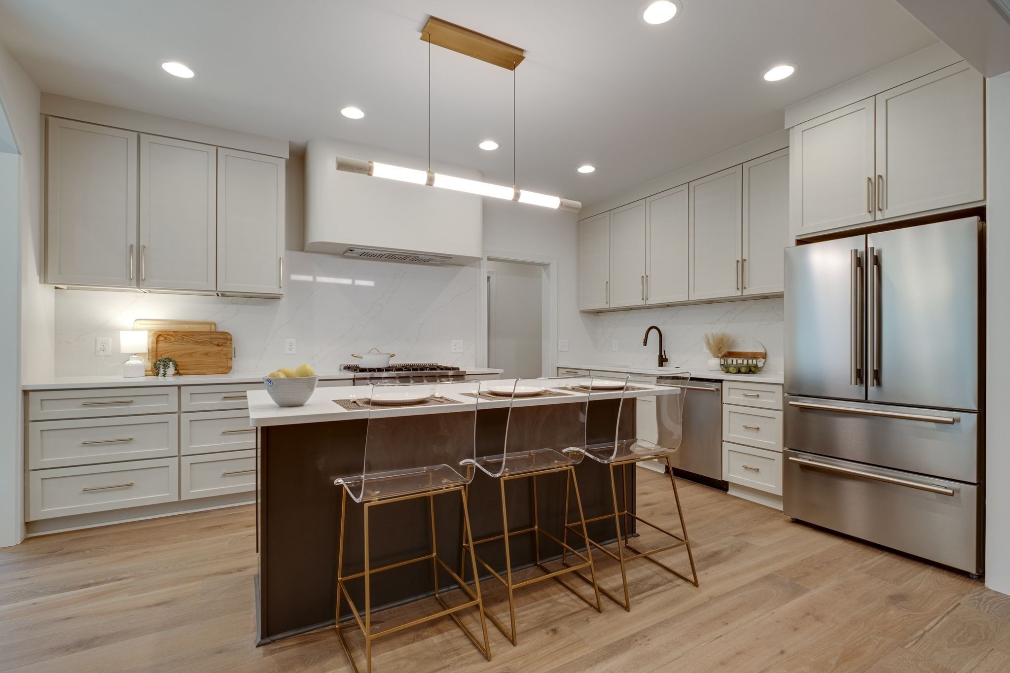 1064 Garton Road Burns, TN 37029 - Photo 13 of 53 a kitchen with kitchen island white cabinets and stainless steel appliances