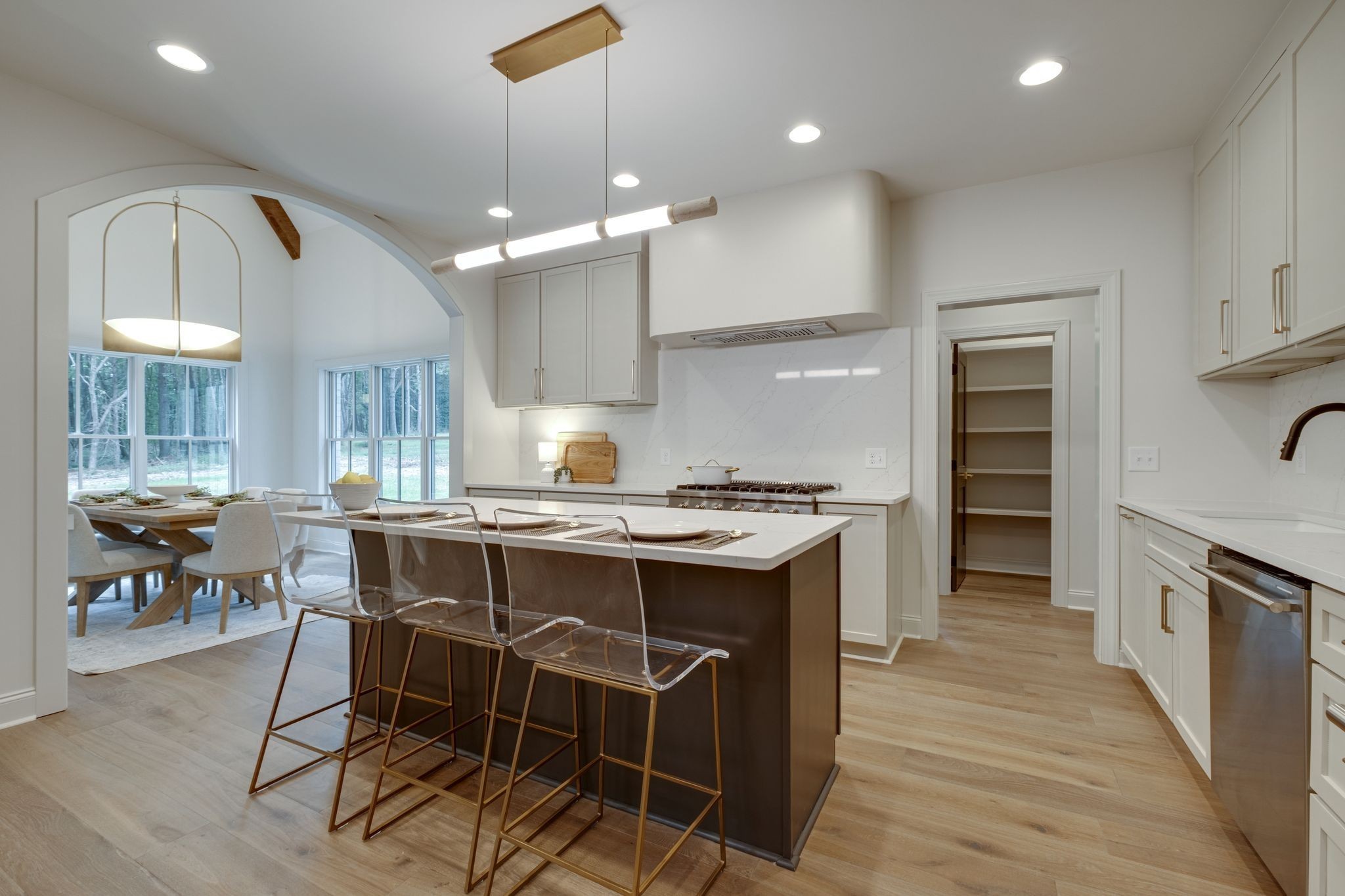 1064 Garton Road Burns, TN 37029 - Photo 15 of 53 a kitchen with kitchen island a island a stove a table and chairs in it
