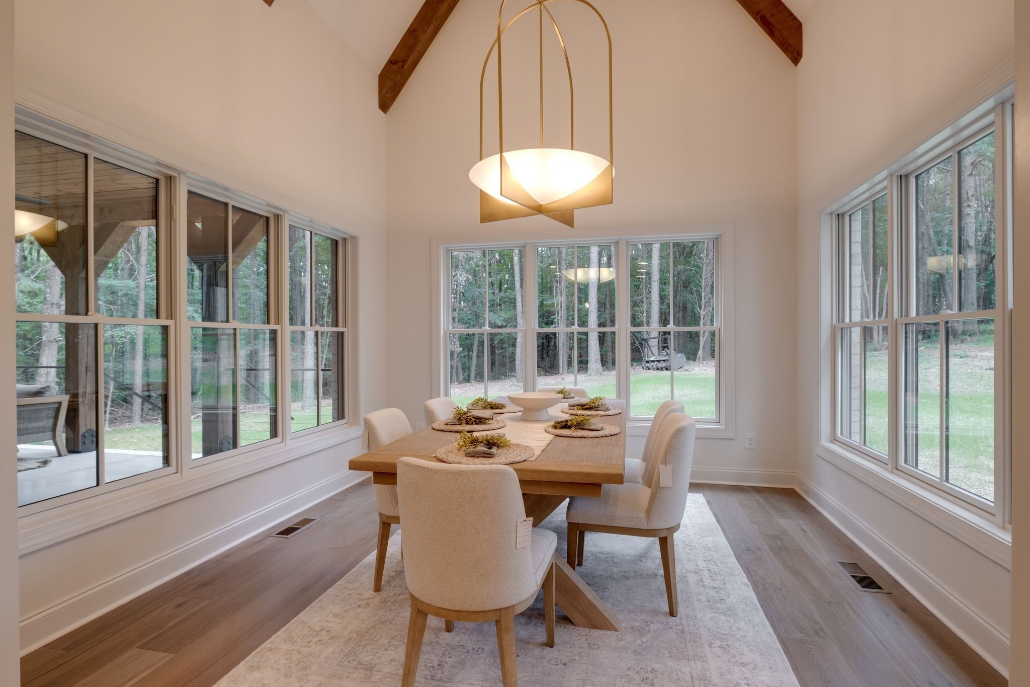 1064 Garton Road Burns, TN 37029 - Photo 17 of 53 a dining room with furniture a chandelier and wooden floor
