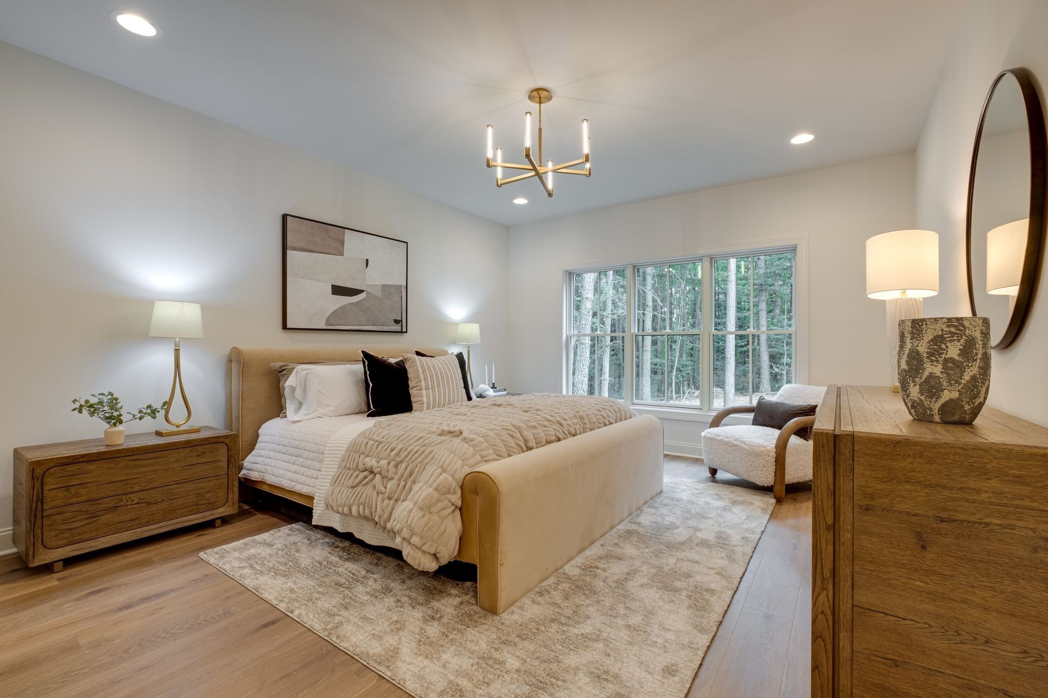 1064 Garton Road Burns, TN 37029 - Photo 20 of 53 a spacious bedroom with a bed and a chandelier