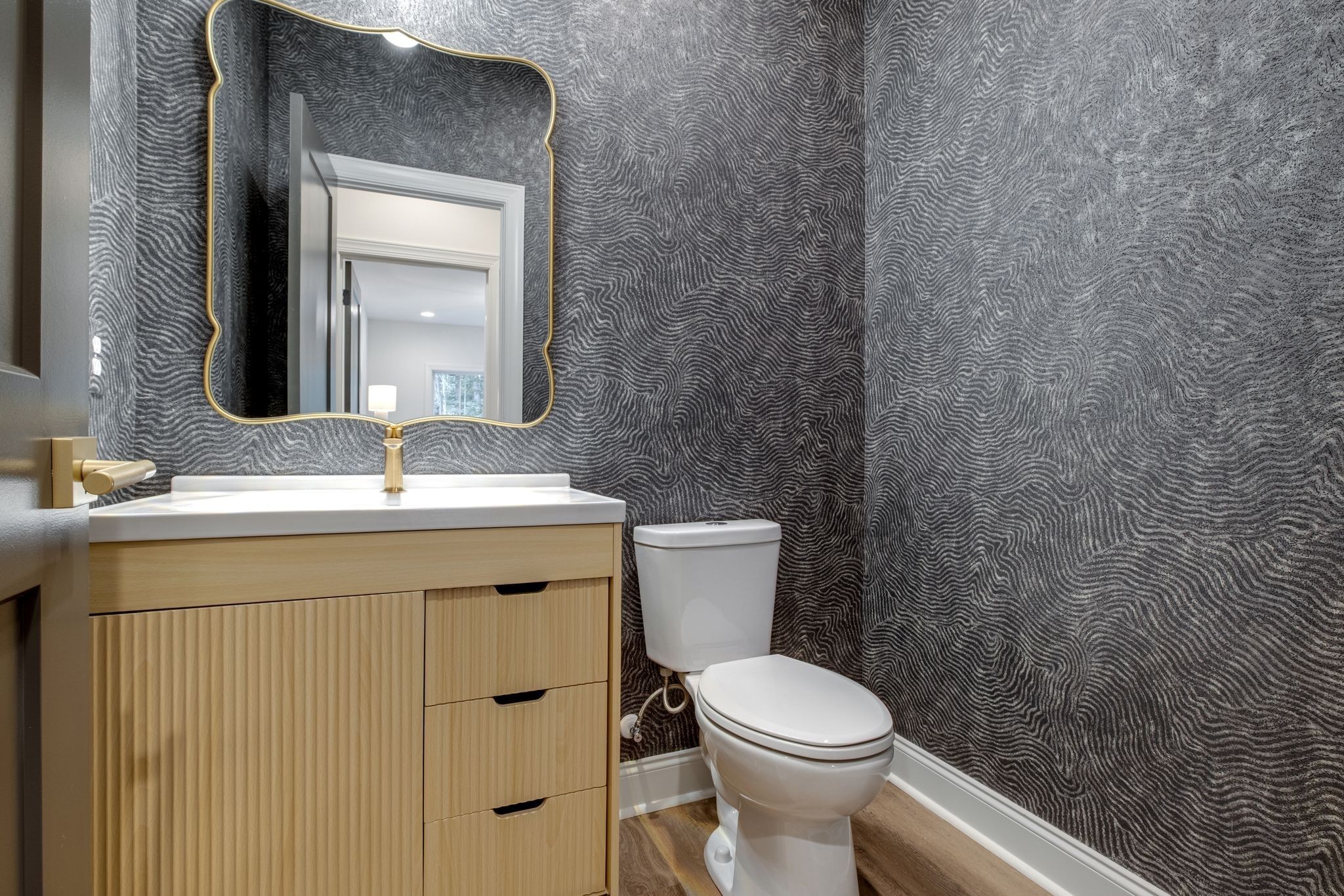 1064 Garton Road Burns, TN 37029 - Photo 39 of 53 a bathroom with a toilet sink vanity and mirror