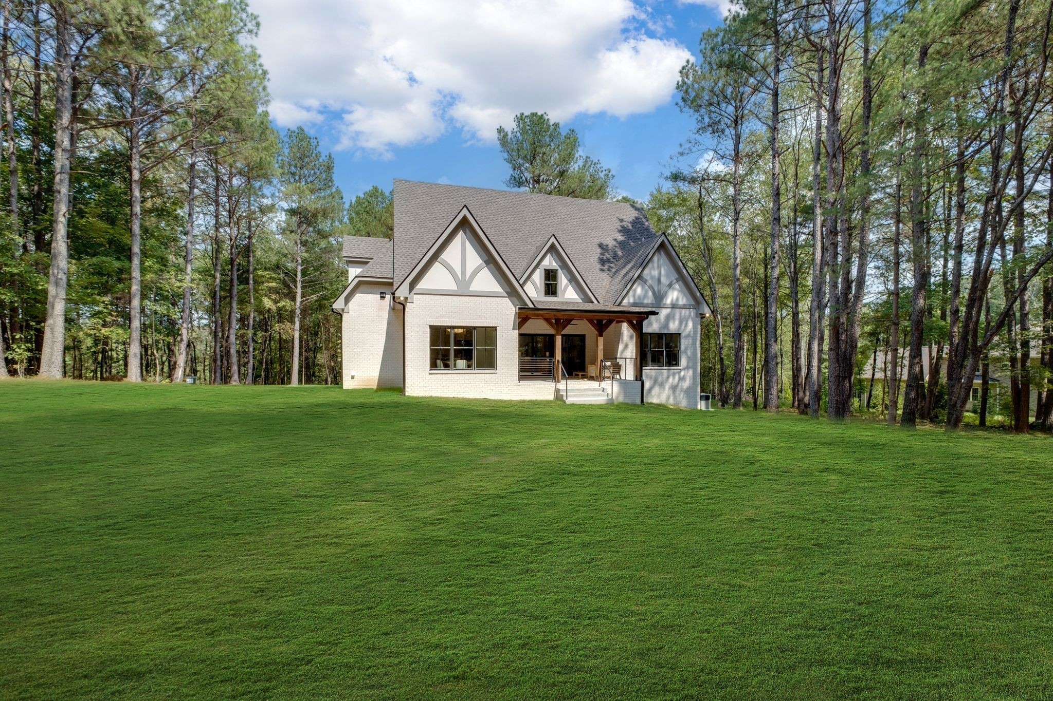 1064 Garton Road Burns, TN 37029 - Photo 45 of 53 a front view of a house with a garden