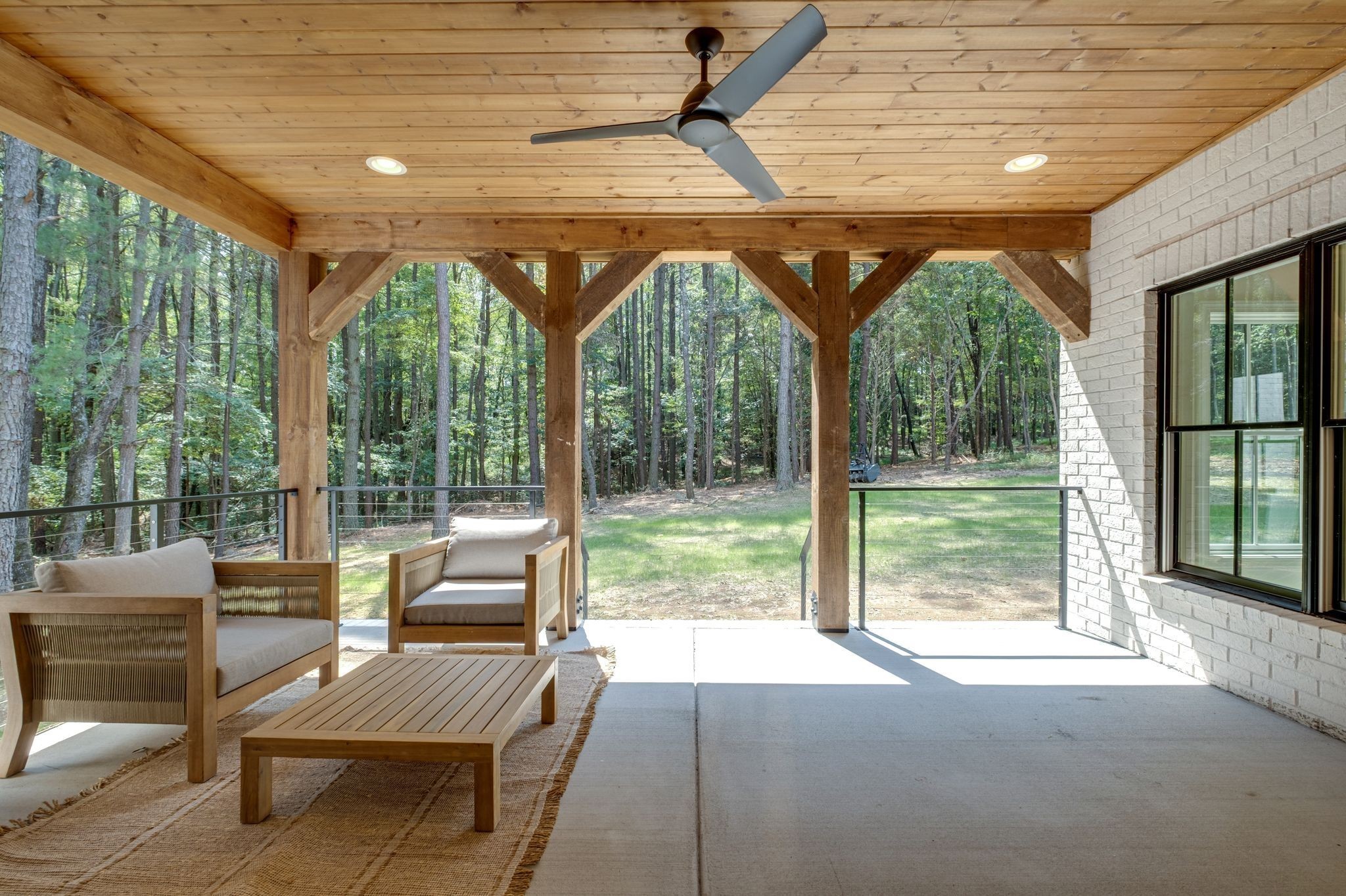 1064 Garton Road Burns, TN 37029 - Photo 6 of 53 a living room with furniture and floor to ceiling windows