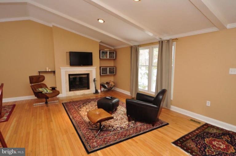 2509 Foxcroft Way Reston, VA 20191 - Photo 18 of 22 a living room with furniture or couch and a fireplace