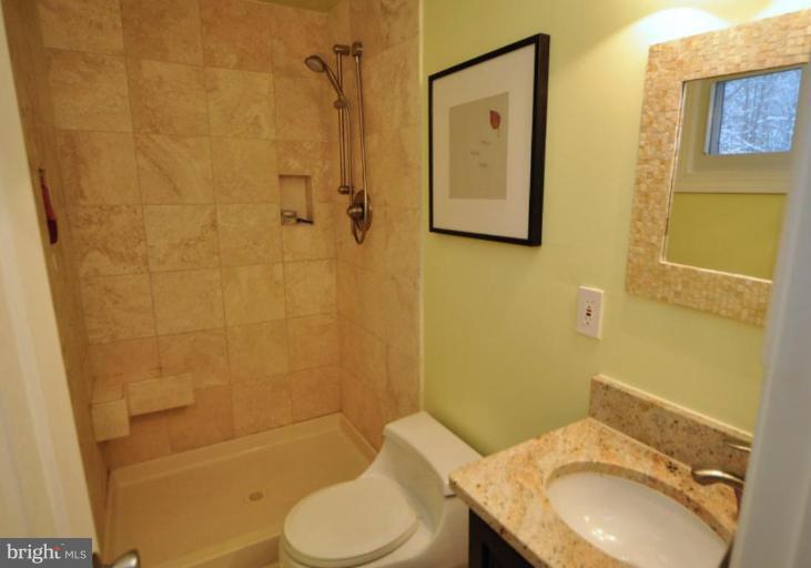 2509 Foxcroft Way Reston, VA 20191 - Photo 19 of 22 a bathroom with a sink toilet and shower