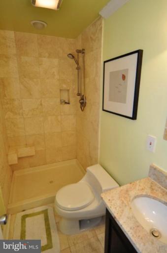 2509 Foxcroft Way Reston, VA 20191 - Photo 20 of 22 a bathroom with a granite countertop toilet and a sink