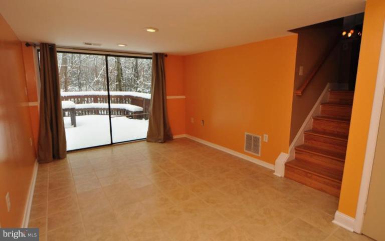 2509 Foxcroft Way Reston, VA 20191 - Photo 10 of 22 an empty room with wooden floor and windows