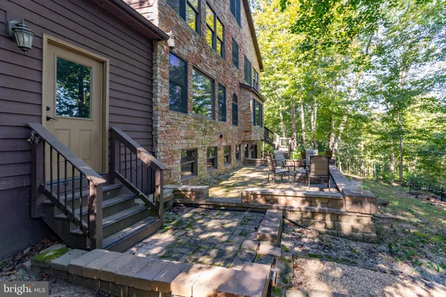 a living room with furniture a window and a fireplace