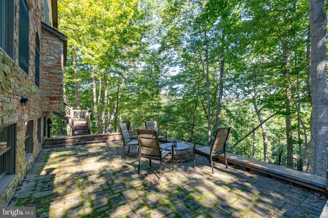 a living room with fireplace furniture and a flat screen tv