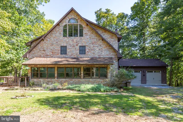 a view of a lake with large trees
