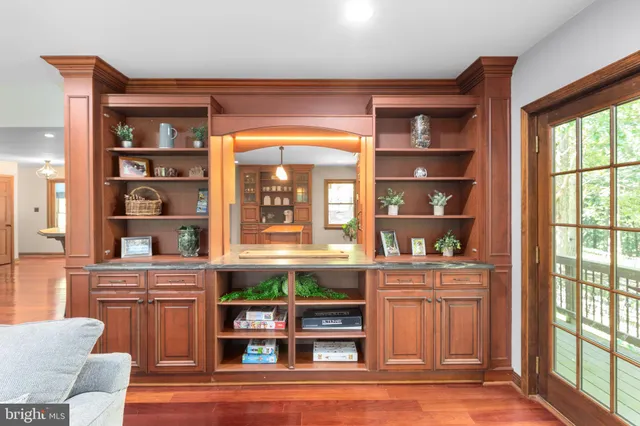 a view of a livingroom with furniture and a flat screen tv