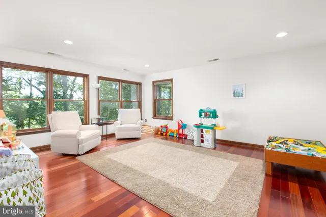 a view of a room with wooden floor