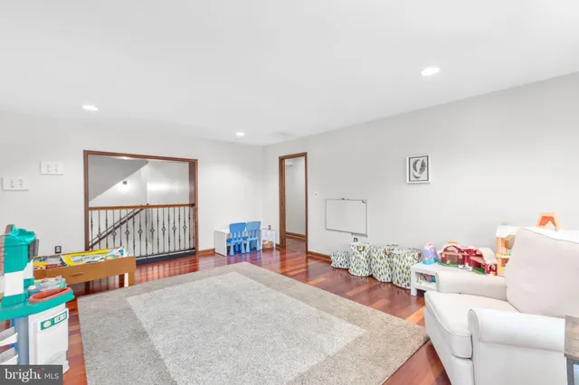 a backyard of a house with a yard and outdoor seating