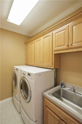 1099 Sunset Road Brentwood, TN 37027 - Photo 12 of 20 Downstairs laundry room with extra cabinet space and sink