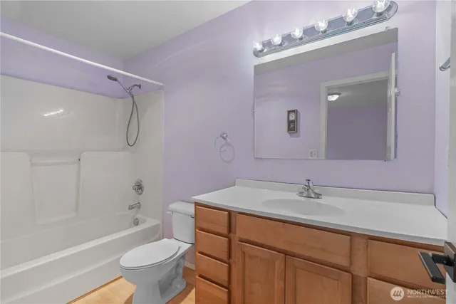 a bathroom with a sink toilet tub and shower
