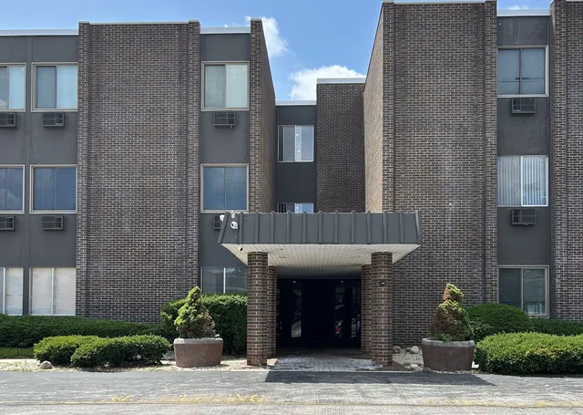 a view of a building with potted plants